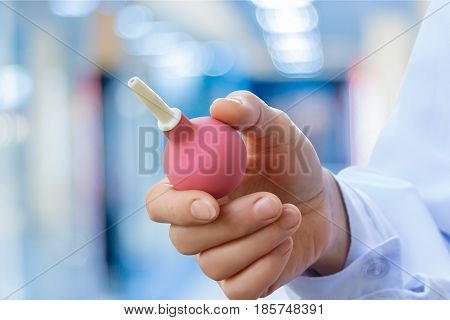 Enema In The Doctor's Hand .