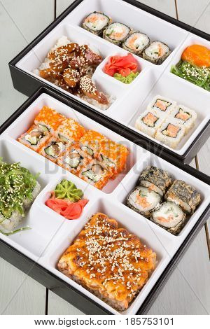 Bento lunch boxes served on wooden table