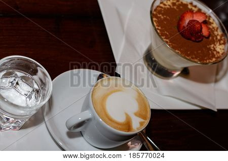 Served with milk froth and sweet dessert