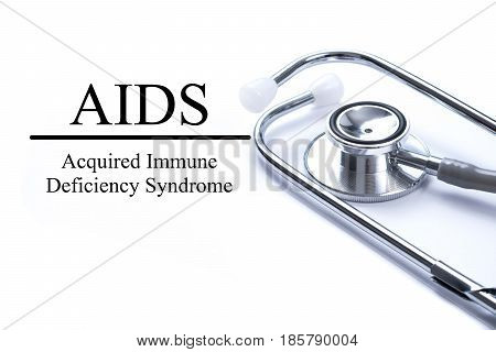 Page with AIDS (Acquired Immune Deficiency Syndrome) on the table with stethoscope medical concept
