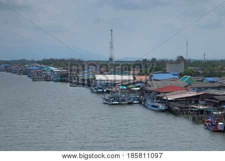 RAYONG THAILAND -APR 17 2017:Pra-Sae Sea Port Rayong province For shipping. at the bridge for see view fishing village there are also small fishing boats.