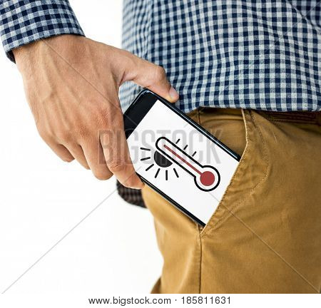 Hand holding digital device network graphic overlay from trouser pocket