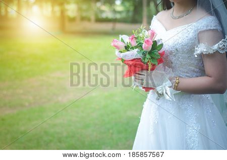 Weding in park with golden light in the morning