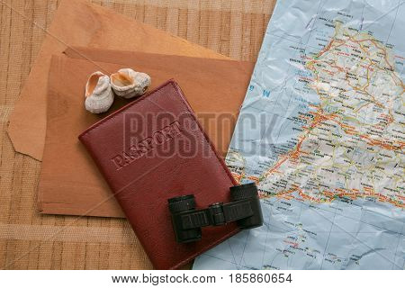 Travel Planning - Map With Passport, Shells And Binoculars