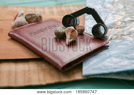 Travel Planning - Map With Passport, Shells And Binoculars