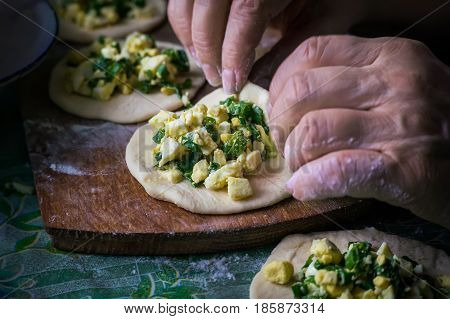 Homemade Cakes Of The Dough In The Women's Hands. The Process Of Making Pie Dough By Hand