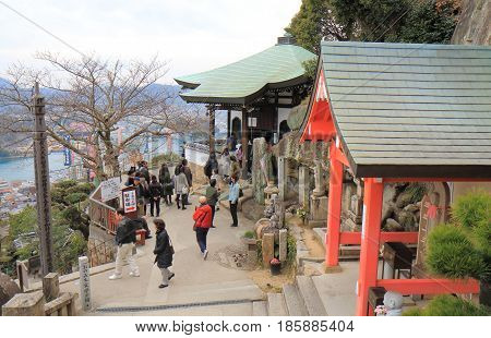 HIROSHIMA JAPAN - MARCH 18, 2017: Unidentified people visit Senkoji temple in Onomichi Onomichi is a historical city with many temples and small alleys.