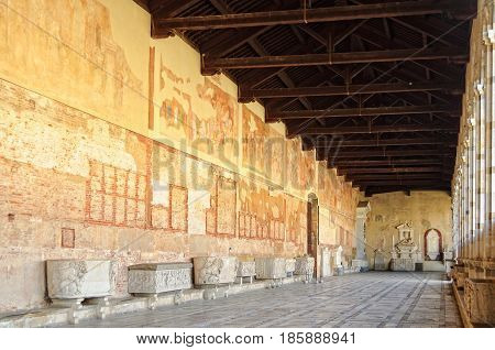 Frescoes and sarcophagi in the hallway of the Cemetery (Camposanto) on the Square of Miracles (Campo dei Miracoli) in Pisa, Tuscany, Italy - 8 October 2011