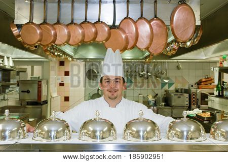 Cook On The Kitchen Of A Hotel At Leukerbad