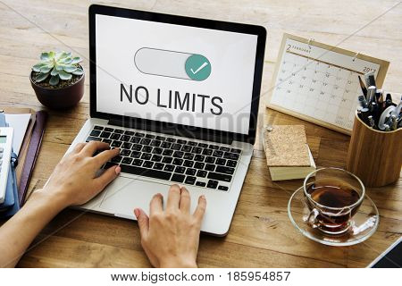 Hands working on laptop network graphic overlay