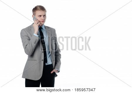 young businessman talking on the phone. in a business suit on a white background.
