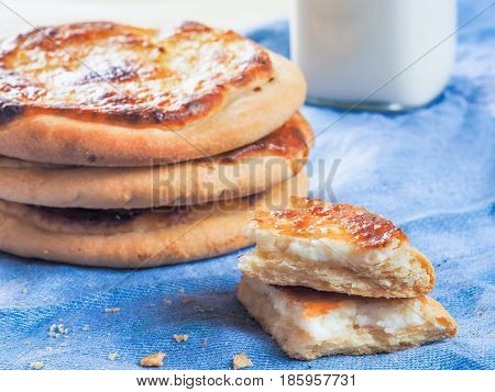 Traditional russian pasties Shanga - opened circle pie with cottage cheese. Close up view of carols cheesecake with cottage cheese.