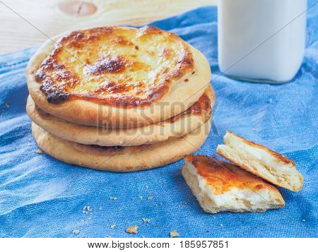 Traditional russian pasties Shanga - opened circle pie with cottage cheese. Close up view of carols cheesecake with cottage cheese.