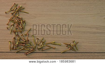 Golden steel Screws on grey wooden board