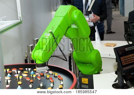 Hannover, Germany - March, 2017: Fanuc industrial robot hand on exhibition Cebit 2017 in Hannover Messe, Germany
