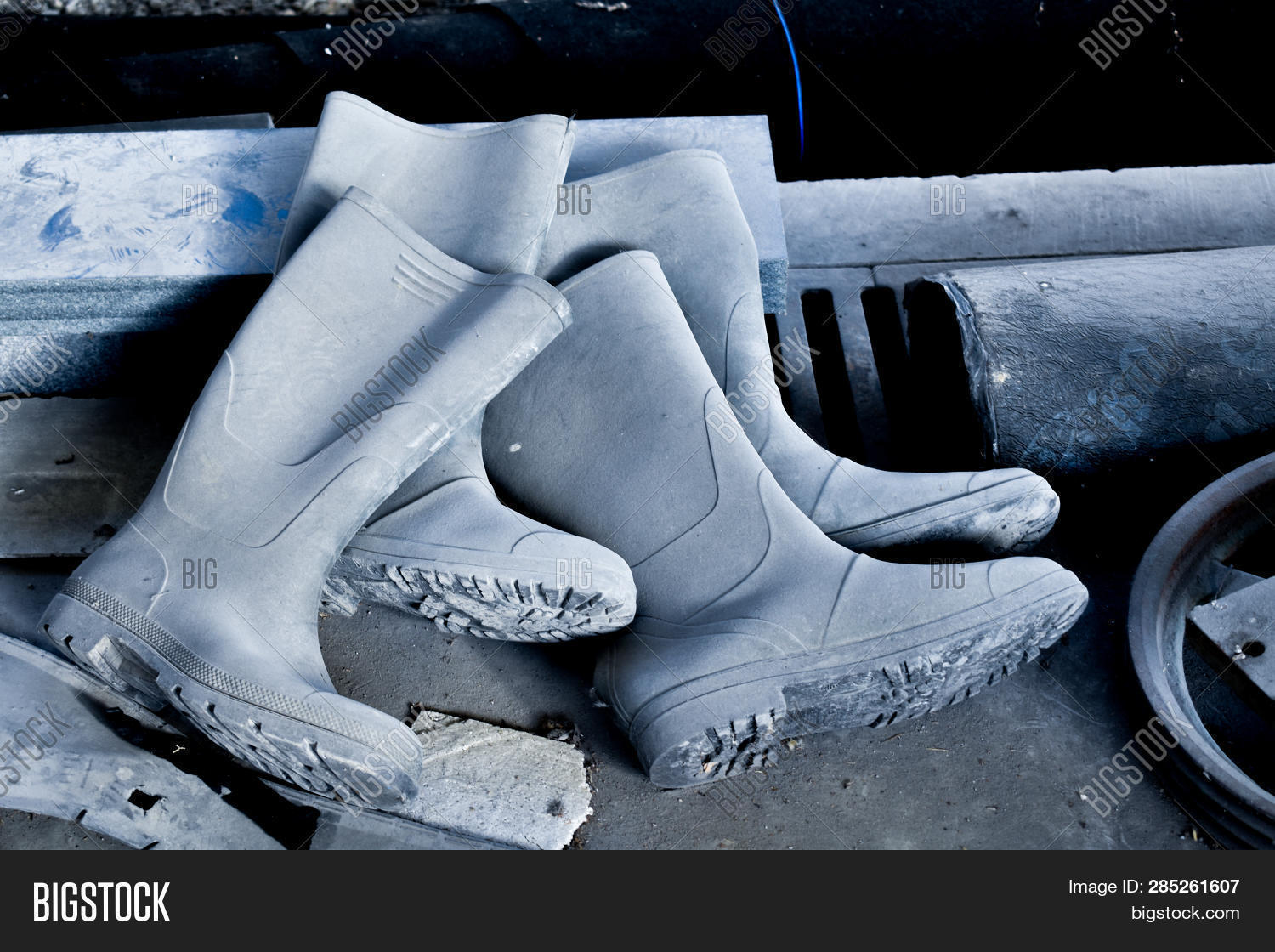 Dirty Rubber Boots Of Workers In The Construction Site, 51 OFF