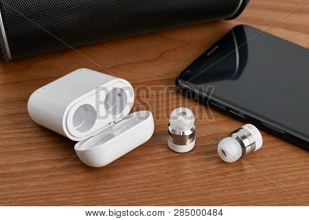 Wireless Cordless Bluetooth Earbuds And Chargeable Case With Smartphone And Partable Speaker