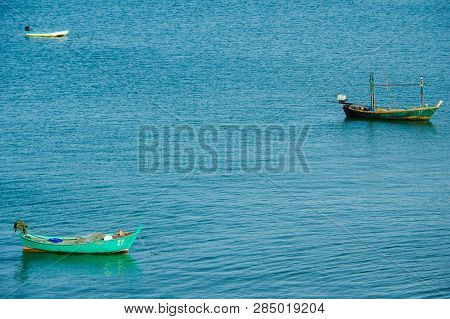 Fisherman Boats Anchored In The Blue Sea