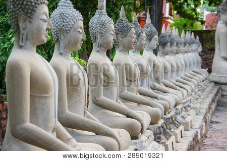 The Row Of Sitting Buddha Images In The Temple