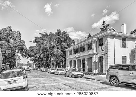 Clanwilliam, South Africa, August 22, 2018: A Street Scene, With A Bank, People And Vehicles, In Cla