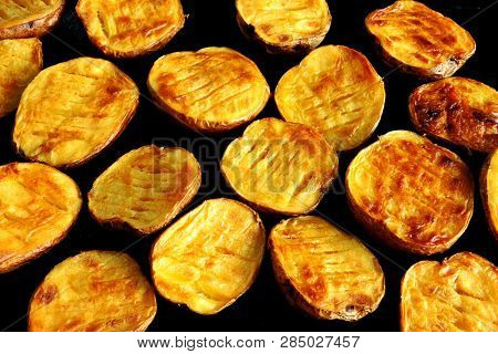Baked Potato Halves. Ruddy Baked Potatoes In The Peel.