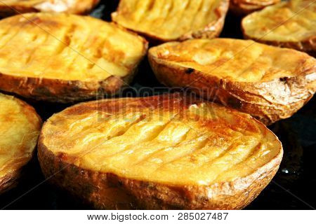 Baked Potato Halves. Ruddy Baked Potatoes In The Peel.