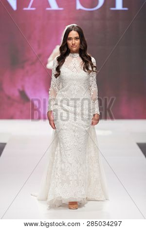 ZAGREB, CROATIA - FEBRUARY 02, 2019: Fashion model in a wedding dress walking down the runway at the Wedding fair