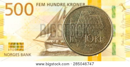 10 Norwegian Krone Coin Against 500 New Norwegian Krone Banknote