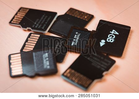 Group Of Microsd Cards Over A Wooden Table