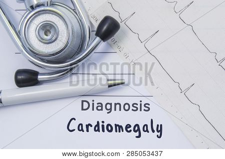 Diagnosis Of Cardiomegaly. Stethoscope, Printed Electrocardiogram And Pen Are On Paper Medical Form 