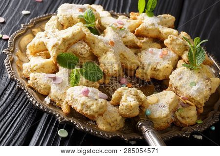 Homemade Tasty Cookies With Pecans, Anise, Zest And Mint Close-up On A Dish. Horizontal