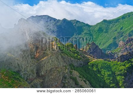 Nature Scene Of Green Mountains Against Cloudy Blue Sky. View From Pico Do Ariero On Portuguese Isla