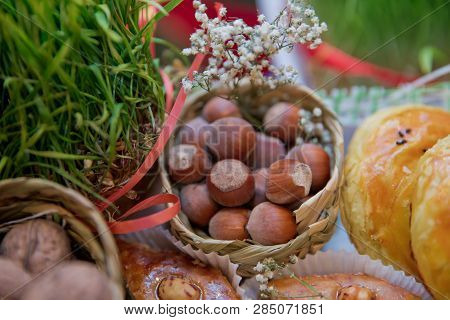 Hazelnuts, Filbert In Burlap Sack On Wooden Backdrop. Heap Or Stack Of Hazelnuts. Hazelnut Backgroun