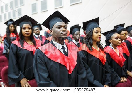 Grodno, Belarus - June, 2018: Foreign African Medical Students In Square Academic Graduation Caps An
