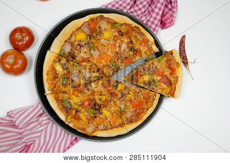 Pizza With Sauce, Bellpepper, Seasoning, Tomato In White Background