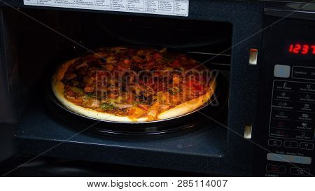 Pizza With Sauce, Bell Pepper, Seasoning, Tomato In White Background