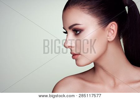 Beautiful Young Woman With Clean Fresh Skin. Perfect Makeup. Beauty Fashion. Eyelashes. Cosmetic Eye
