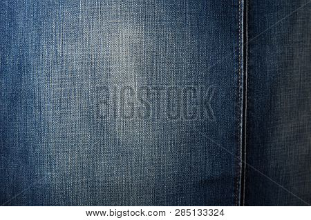 Denim Chair. Modern Armchair Over Rustic Wall In Living Room Interior Redecoration Renovation Concep