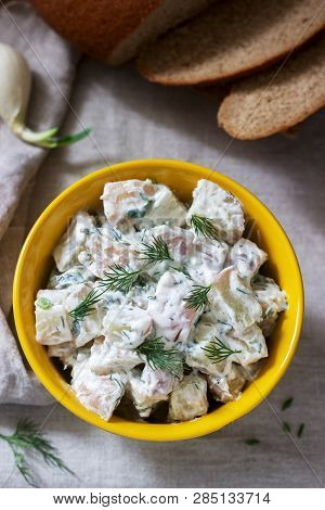Traditional Cold Potato Salad With Onions And Herbs On A Linen Tablecloth Background. Rustic Style.