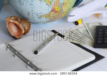 Planning A Trip Around The World. On Holiday With The Whole Family. In The Photo: Plane, Money, Shel