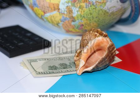 Planning A Trip Around The World. On Holiday With The Whole Family. In The Photo: Plane, Money, Shel