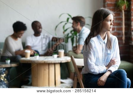 Girl Outcast Sits Apart From Peers In Cafeteria