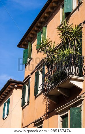 Italian Style House With The Green Windowframes And The Palm On The Balcony, Verona, Italy - Image