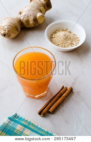 Jamu Healthy Asian Drink With Turmeric And Cinnamon Stick, Orange Juice
