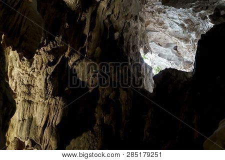 Cave Deep Dark Inside Near Entrance. Underground Of Stone Rock Mountain. Ha Long Vietnam Nature Back