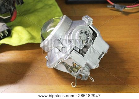 Macro View Of Repairing, Installation And Turning Headlight Of Modern Automobile And Car Projector L