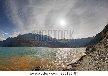 Mountains And Lake Roselend  With A Dike