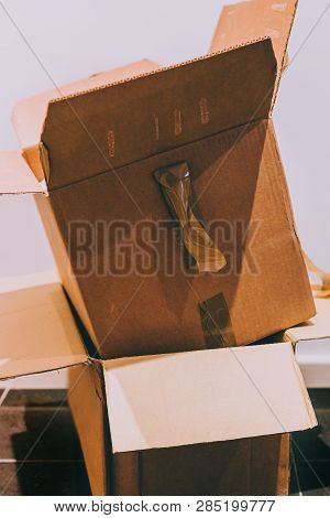 Two Opened Cardboard Boxes Stacked On Top Of Each Other, Concept Of Heavy Delvery Or Moving House