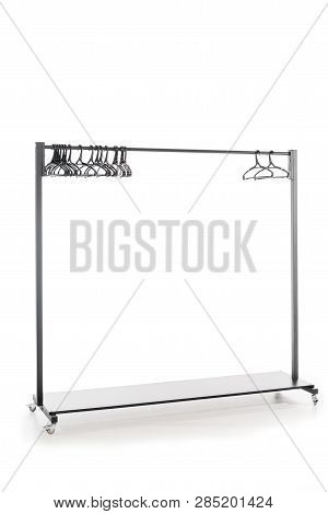 Hatstand With Hangers On White Background With Copy Space