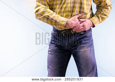 Urolithiasis. Chronic Pancreatitis. Stones In The Urine. The Man Grabbed His Groin In A Fit Of Pain
